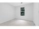 Bedroom featuring a window, carpeting, and light walls at 4800 Countryside E, Stone Mountain, GA 30083
