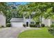 Charming two-story home with a manicured lawn and welcoming curb appeal, featuring an attached two-car garage and classic design at 4800 Countryside E, Stone Mountain, GA 30083