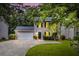 Charming two-story home with gray siding, black shutters, attached garage, and well-manicured lawn at 4800 Countryside E, Stone Mountain, GA 30083