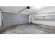 Spacious garage with a large overhead door provides ample parking and storage space at 4800 Countryside E, Stone Mountain, GA 30083
