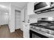 Bright kitchen with stainless steel appliances and white cabinets offer a modern cooking space at 4800 Countryside E, Stone Mountain, GA 30083