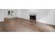Spacious living room featuring wood floors, a fireplace, and french doors to the exterior at 4800 Countryside E, Stone Mountain, GA 30083