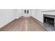 Elegant living room with hardwood floors, white trim, and a cozy fireplace at 4800 Countryside E, Stone Mountain, GA 30083