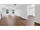 Bright open living room showcasing hardwood floors, white walls, and abundant natural light at 4800 Countryside E, Stone Mountain, GA 30083