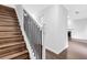 Elegant staircase with wooden steps and a white banister leading to the upper level at 4800 Countryside E, Stone Mountain, GA 30083