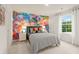 Bright bedroom with a modern design featuring colorful brick wall art and a comfortable bed with stylish bedding at 7225 Lacey Lot 147 Dr, Douglasville, GA 30134
