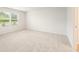 Empty room with a window and neutral carpet at 7225 Lacey Lot 147 Dr, Douglasville, GA 30134