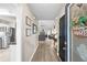 Inviting foyer with hardwood floors, leading to a spacious living area and modern kitchen at 7720 Paddocks Mill Dr, Cumming, GA 30041