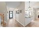 Inviting foyer leading to a modern kitchen with stainless steel appliances and a comfortable living space at 7720 Paddocks Mill Dr, Cumming, GA 30041