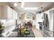 Charming kitchen and breakfast nook area with stainless appliances and eat in dining area near large window at 7720 Paddocks Mill Dr, Cumming, GA 30041