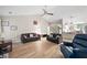 Comfortable living room area with vaulted ceilings and open concept feel to the dining and kitchen area at 7720 Paddocks Mill Dr, Cumming, GA 30041