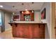 Bar area featuring custom cabinets and granite counters with pendant lighting at 1120 Bentwater Dr, Acworth, GA 30101