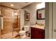 Full bathroom with granite counters, tile floors, and tile shower with glass enclosure at 1120 Bentwater Dr, Acworth, GA 30101