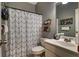 A bathroom with a vanity, toilet and bathtub shower combination at 1120 Bentwater Dr, Acworth, GA 30101