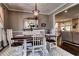 Dining room featuring hardwood floors, pendant light, and view to the kitchen at 1120 Bentwater Dr, Acworth, GA 30101