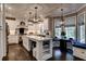 Beautiful kitchen with white cabinetry, an island with seating, and a breakfast nook with large windows at 1120 Bentwater Dr, Acworth, GA 30101