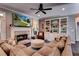 Cozy living room with fireplace, built-in shelves, TV, and an inviting sectional sofa at 1120 Bentwater Dr, Acworth, GA 30101