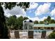 Leisure pool area with a mushroom water feature and comfortable loungers at 1120 Bentwater Dr, Acworth, GA 30101
