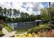 The Bentwater community has outdoor tennis courts and lush landscaping at 1120 Bentwater Dr, Acworth, GA 30101