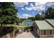 Exterior view of Bentwater tennis courts and landscaped grounds from a building at 1120 Bentwater Dr, Acworth, GA 30101