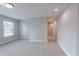 An open bedroom area is shown with neutral paint and carpet at 139 Vinca Cir, Suwanee, GA 30024