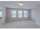 An open bedroom area features three large bright windows at 139 Vinca Cir, Suwanee, GA 30024