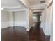 A dining room space featuring elegant molding details, dark hardwood flooring, and neutral walls at 139 Vinca Cir, Suwanee, GA 30024