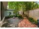 Scenic backyard featuring a brick pathway, an outbuilding, and mature landscaping at 2283 Pembrook Ne Pl, Atlanta, GA 30324