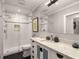 Bathroom with subway tile shower, marble countertop, and modern fixtures at 2283 Pembrook Ne Pl, Atlanta, GA 30324