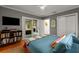 Bright bedroom with a sliding glass door, a ceiling fan, and built in shelving at 2283 Pembrook Ne Pl, Atlanta, GA 30324