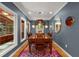 Dining room with a long wooden table, modern light fixture, and stylish decor at 2283 Pembrook Ne Pl, Atlanta, GA 30324