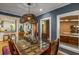 Dining room with a glass-top table and wicker chairs with a view to the kitchen at 2283 Pembrook Ne Pl, Atlanta, GA 30324