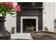 Elegant fireplace with black mantle and marble surround at 2283 Pembrook Ne Pl, Atlanta, GA 30324