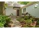Inviting front entrance with a brick walkway, modern door, and seating area at 2283 Pembrook Ne Pl, Atlanta, GA 30324