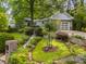 Beautifully landscaped front yard with a charming home and a two car garage at 2283 Pembrook Ne Pl, Atlanta, GA 30324