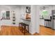 Charming kitchen features white cabinetry, stainless steel appliances, and a cozy breakfast bar at 2283 Pembrook Ne Pl, Atlanta, GA 30324