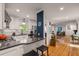 Open kitchen featuring granite countertops, stainless appliances, and view into living area at 2283 Pembrook Ne Pl, Atlanta, GA 30324