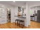 Bright kitchen with white cabinets, stainless steel appliances and adjacent pantry at 2283 Pembrook Ne Pl, Atlanta, GA 30324