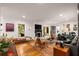 Bright living room with hardwood floors, stylish decor, and a cozy fireplace at 2283 Pembrook Ne Pl, Atlanta, GA 30324