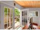 Office featuring double doors leading to a deck and view of greenery at 2283 Pembrook Ne Pl, Atlanta, GA 30324