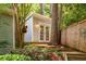 Charming backyard outbuilding with double doors, set amidst lush greenery and mature trees at 2283 Pembrook Ne Pl, Atlanta, GA 30324