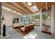 Sunroom with skylights, ceiling fan, and wood furniture at 2283 Pembrook Ne Pl, Atlanta, GA 30324