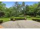 Backyard patio with manicured hedges and lawn, perfect for outdoor enjoyment at 2503 Regency Lake Dr, Marietta, GA 30062