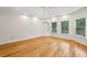 Bright, empty bedroom with hardwood flooring, recessed lighting, and large windows offering natural light at 2503 Regency Lake Dr, Marietta, GA 30062