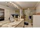 Bright bathroom with double sinks, a large mirror, and a glass-enclosed shower at 2538 Anchors Way, Snellville, GA 30078