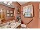 Half bathroom features framed artwork and a marble-top sink at 2538 Anchors Way, Snellville, GA 30078