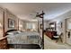 Large bedroom features a four-poster bed, classic decor, and ample space for relaxation and comfort at 2538 Anchors Way, Snellville, GA 30078