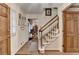 Inviting foyer featuring hardwood floors, staircase, and elegant wood trim, creating a warm entrance at 2538 Anchors Way, Snellville, GA 30078