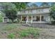 Charming two-story house boasting a spacious covered porch, painted brick, and a two-car garage at 2538 Anchors Way, Snellville, GA 30078