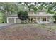 Traditional two-story home featuring painted brick, covered porch, and attached two-car garage at 2538 Anchors Way, Snellville, GA 30078